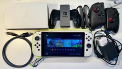 Nintendo Switch OLED Handheld Console – 64GB – White and gamepads