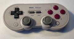 Nintendo Switch OLED Handheld Console – 64GB – White and gamepads