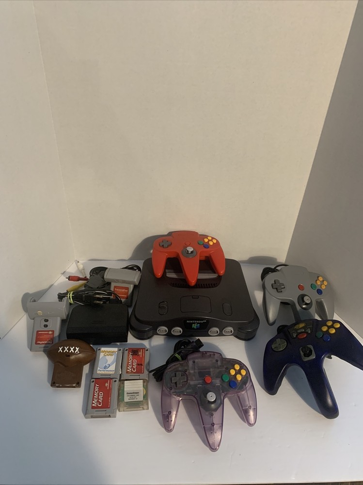 Nintendo 64 Console W/ 4 Controllers , memory cards rumble paks expansion pak