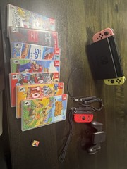 Nintendo switch + Controllers and Games (READ DESC)